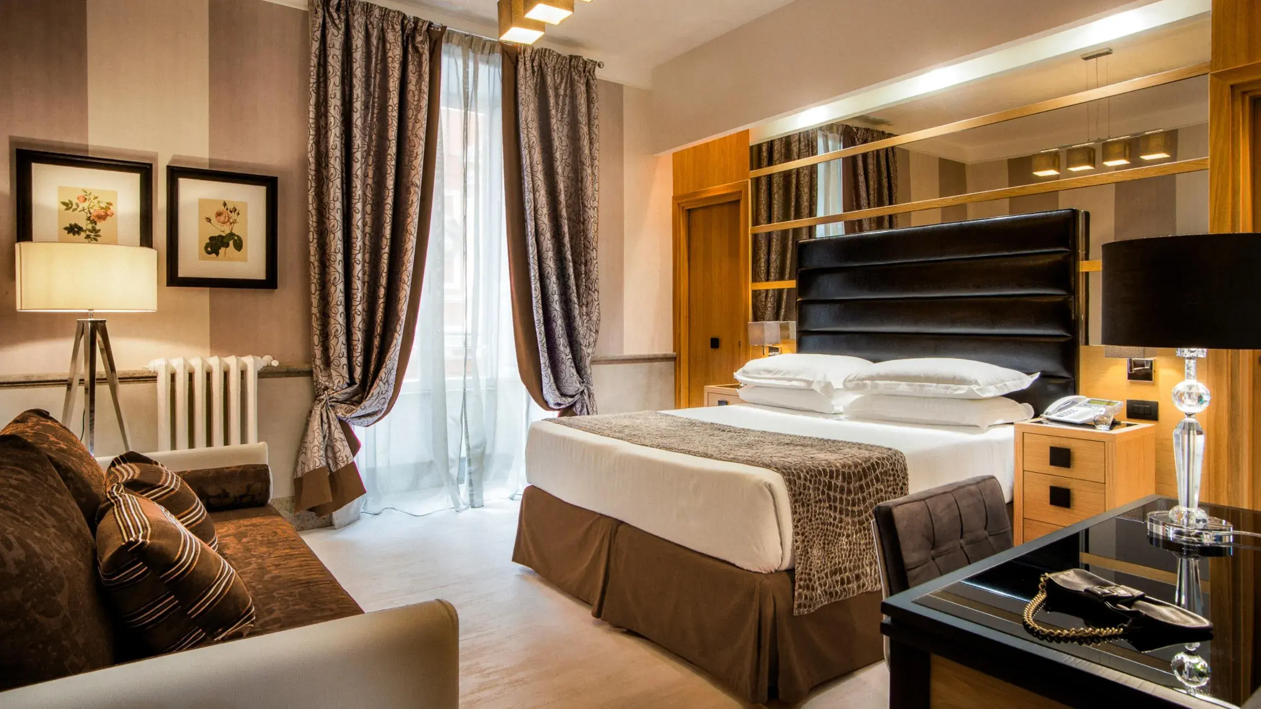 A bedroom in the Royal Court Apartment on Via Vicenza